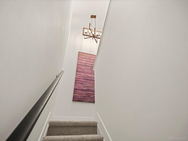 345 Fillmore St Unit 407, Denver, CO 80206 - stairway with a chandelier and baseboards