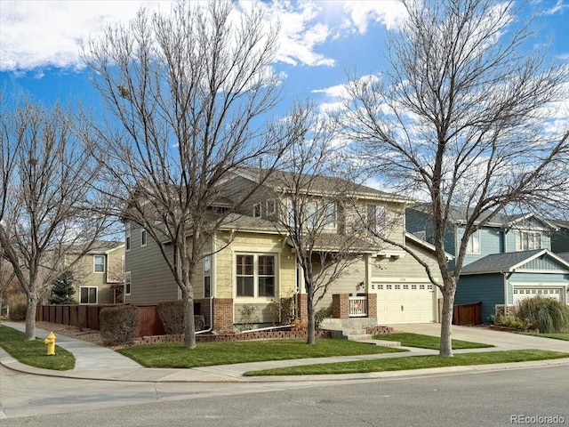 view of front of house with a garage and a front lawn