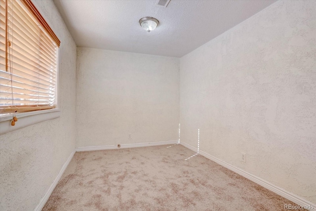 spare room with carpet flooring