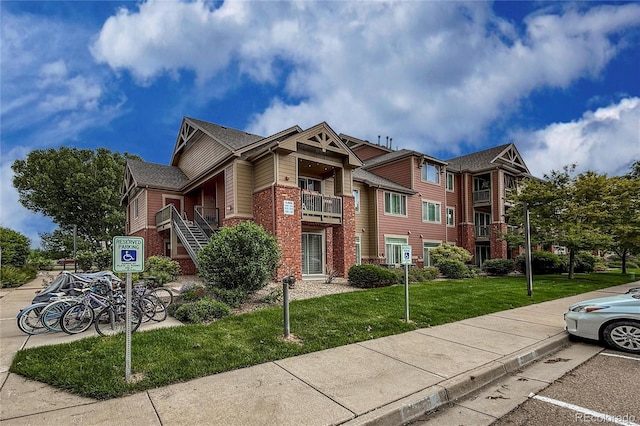 804 Summer Hawk Dr Unit 5105, Longmont, CO 80504 - view of building exterior featuring uncovered parking