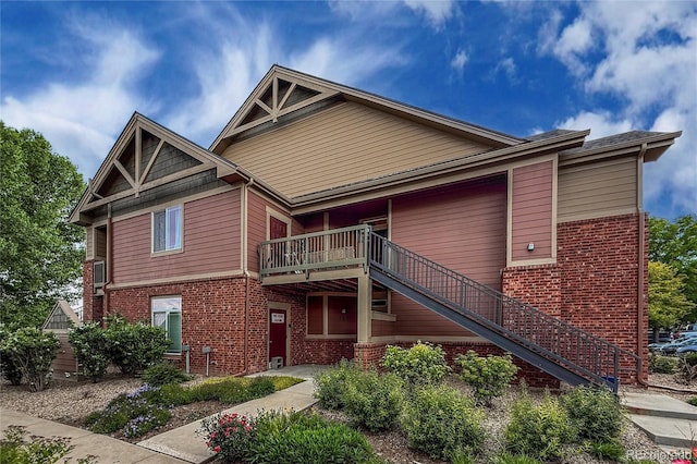 804 Summer Hawk Dr Unit 5105, Longmont, CO 80504 - view of front facade featuring brick siding and stairs