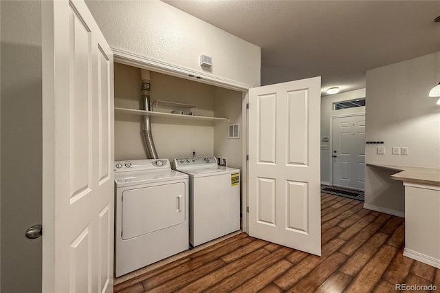 804 Summer Hawk Dr Unit 5105, Longmont, CO 80504 - washroom featuring independent washer and dryer and dark wood-style floors