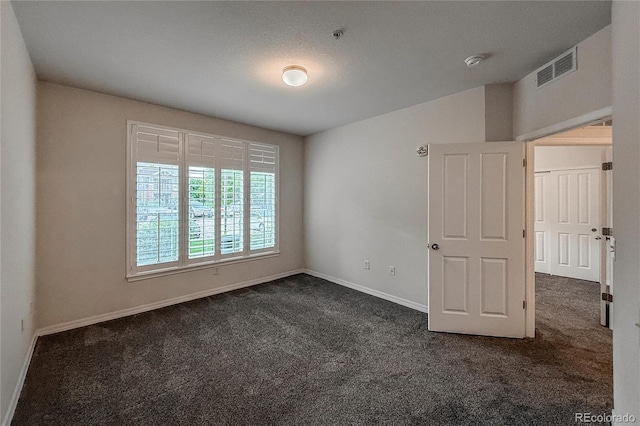 804 Summer Hawk Dr Unit 5105, Longmont, CO 80504 - unfurnished room with dark carpet, baseboards, and a smoke detector
