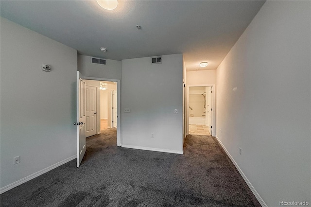 804 Summer Hawk Dr Unit 5105, Longmont, CO 80504 - unfurnished bedroom featuring dark colored carpet and baseboards
