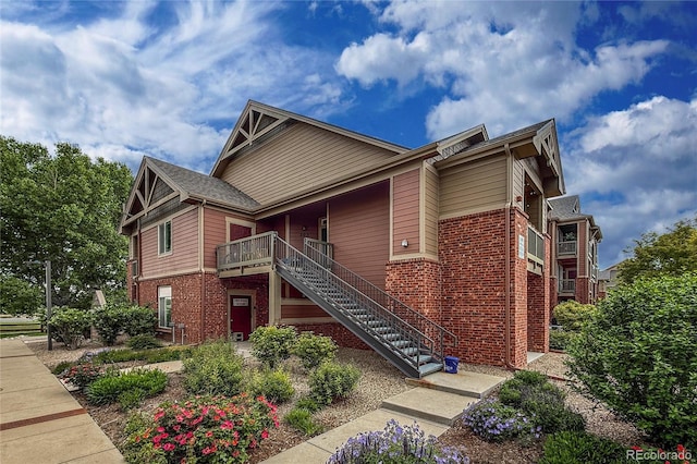 804 Summer Hawk Dr Unit 5105, Longmont, CO 80504 - view of front of home with brick siding and stairway