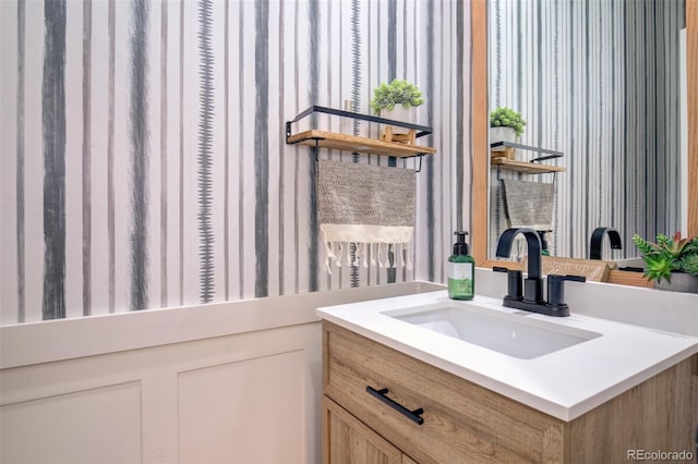 16084 Stonebriar Dr, Parker, CO 80134 - bathroom featuring wallpapered walls and vanity