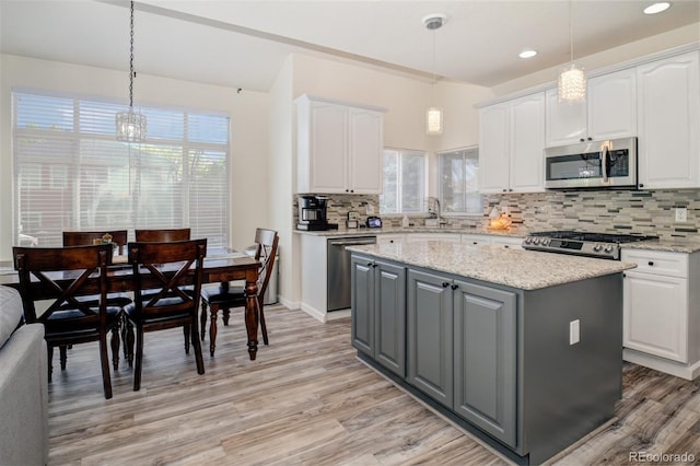 16084 Stonebriar Dr, Parker, CO 80134 - kitchen featuring appliances with stainless steel finishes, gray cabinets, white cabinets, a sink, and recessed lighting