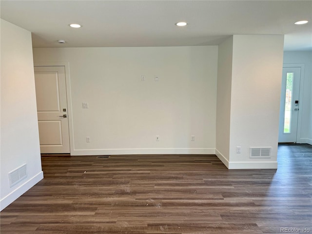 empty room featuring dark wood-type flooring