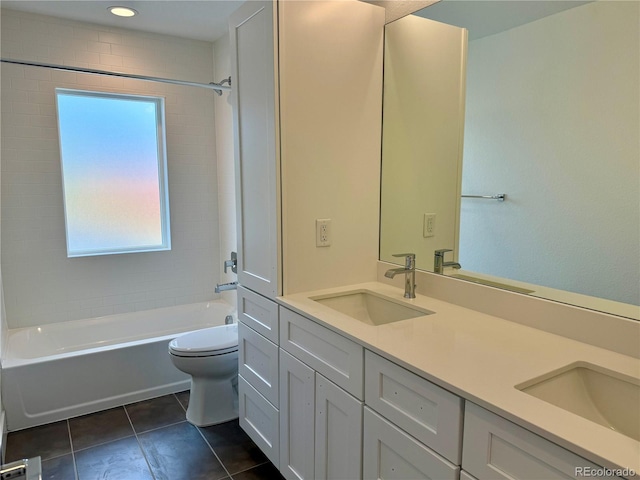 full bathroom with toilet, tiled shower / bath, tile patterned floors, and vanity