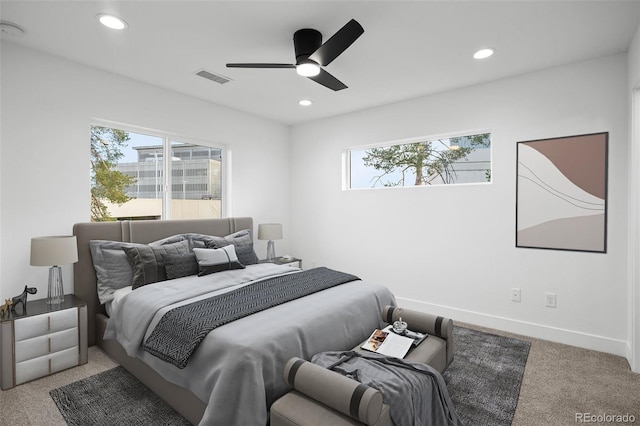 bedroom with multiple windows, recessed lighting, visible vents, and carpet floors