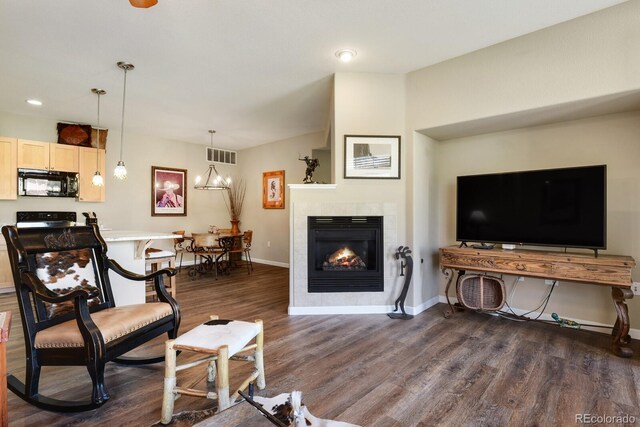 living room featuring dark hardwood / wood-style floors and a fireplace