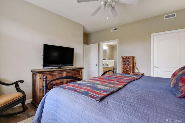 bedroom featuring ceiling fan, dark hardwood / wood-style flooring, and ensuite bathroom