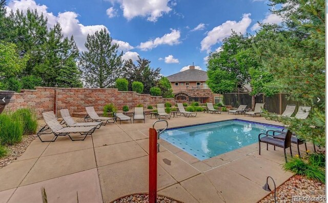 view of pool with a patio