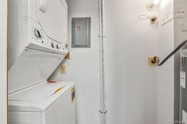 laundry room with laundry area, electric panel, and stacked washing maching and dryer