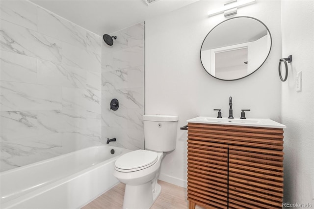 bathroom with toilet, washtub / shower combination, baseboards, and vanity