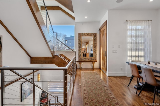 hall with hardwood / wood-style floors