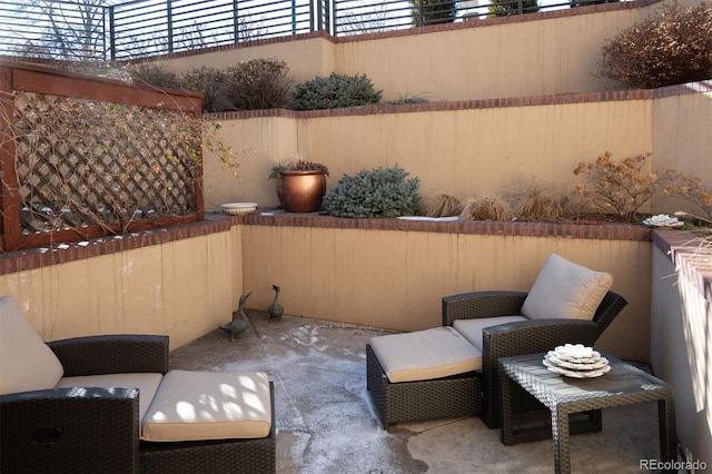 view of patio / terrace featuring fence