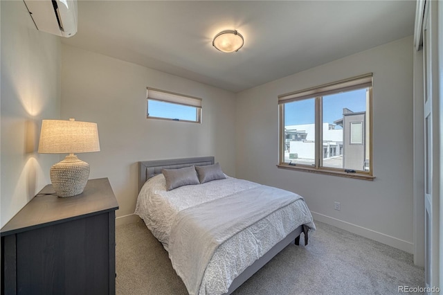 bedroom featuring baseboards, carpet, and an AC wall unit