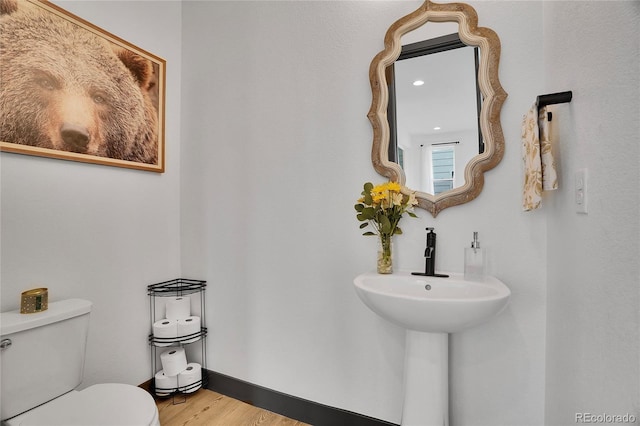 21345 E 59th Dr, Aurora, CO 80019 - half bathroom with toilet and wood finished floors