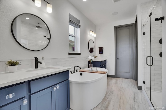 21345 E 59th Dr, Aurora, CO 80019 - bathroom with a shower stall, two vanities, a freestanding tub, and marble finish flooring