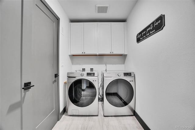 21345 E 59th Dr, Aurora, CO 80019 - laundry area featuring cabinet space and independent washer and dryer