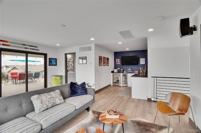 21345 E 59th Dr, Aurora, CO 80019 - living room featuring a dry bar, beverage cooler, light wood finished floors, and recessed lighting