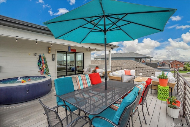 21345 E 59th Dr, Aurora, CO 80019 - wooden terrace featuring a hot tub and outdoor dining space