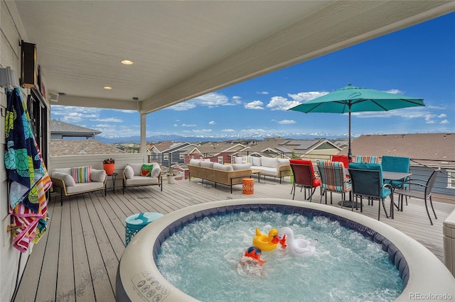 21345 E 59th Dr, Aurora, CO 80019 - view of swimming pool featuring a jacuzzi, a wooden deck, a residential view, an outdoor living space, and outdoor dining space