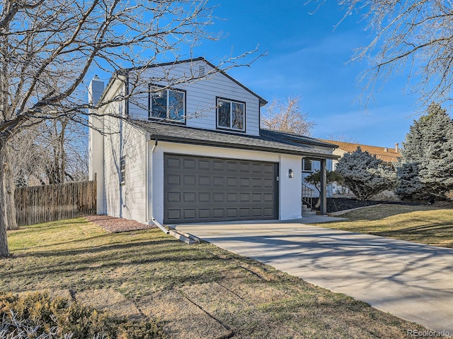 view of front facade featuring an attached garage, fence, concrete driveway, a chimney, and a front yard