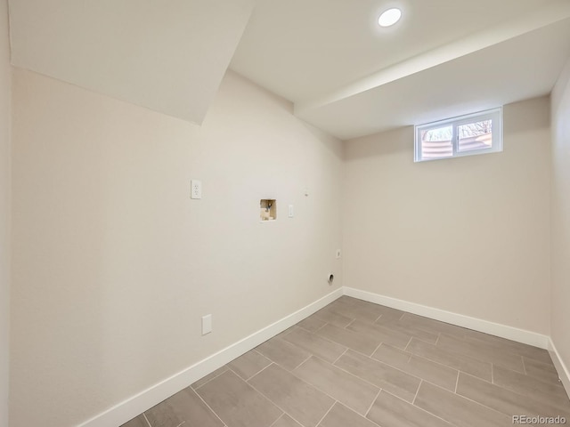 laundry area with laundry area, recessed lighting, hookup for a washing machine, and baseboards