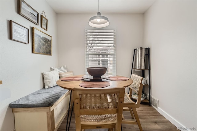 3141 S Tamarac Dr Unit 202E, Denver, CO 80231 - dining area with baseboards, visible vents, wood finished floors, and breakfast area