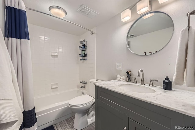 3141 S Tamarac Dr Unit 202E, Denver, CO 80231 - bathroom featuring shower / tub combo with curtain, vanity, toilet, and visible vents