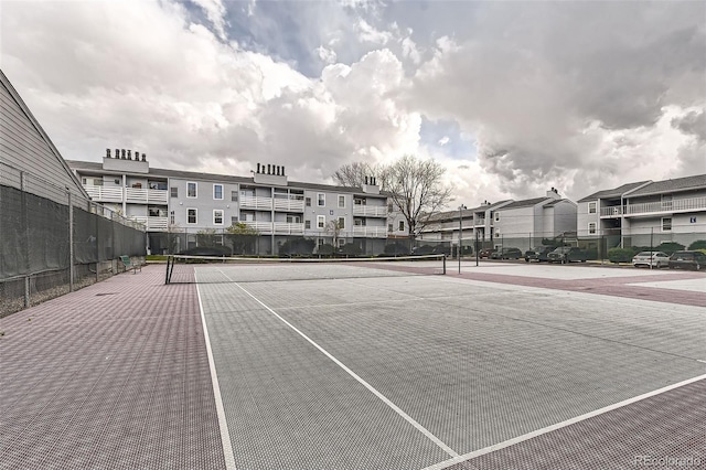 3141 S Tamarac Dr Unit 202E, Denver, CO 80231 - view of tennis court with fence and a residential view