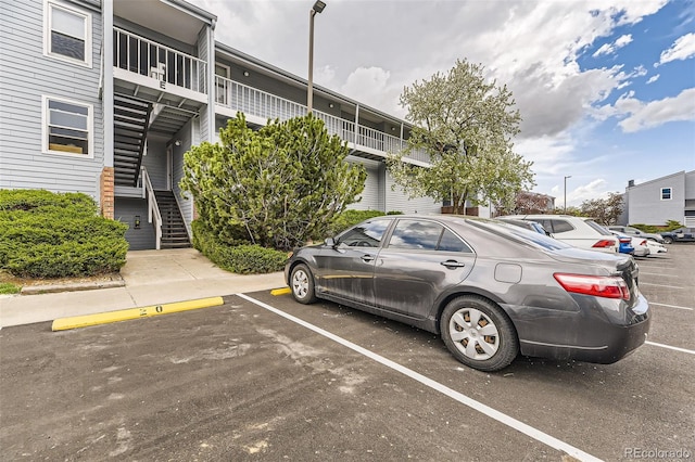 3141 S Tamarac Dr Unit 202E, Denver, CO 80231 - uncovered parking lot with stairway