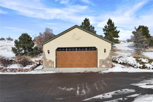 view of snow covered garage