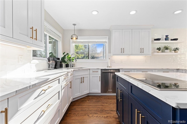 kitchen featuring sink, stainless steel dishwasher, white cabinets, and blue cabinetry