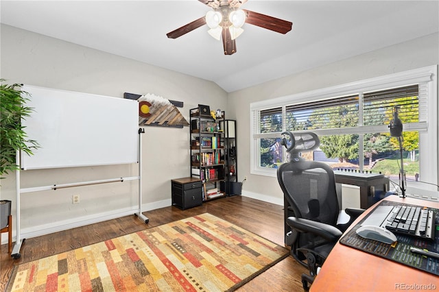 office space featuring ceiling fan, plenty of natural light, lofted ceiling, and dark hardwood / wood-style flooring