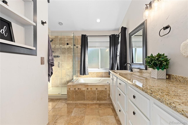 bathroom featuring vanity and shower with separate bathtub