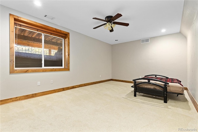 unfurnished room with ceiling fan and light carpet