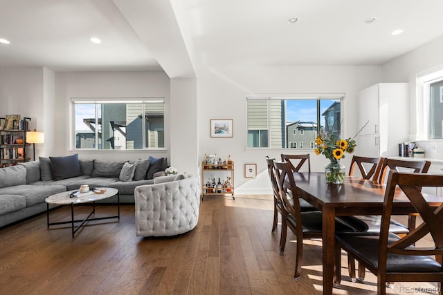 dining area featuring dark wood-type flooring and recessed lighting