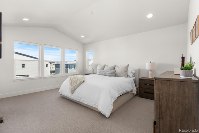 bedroom with lofted ceiling, recessed lighting, baseboards, and light colored carpet