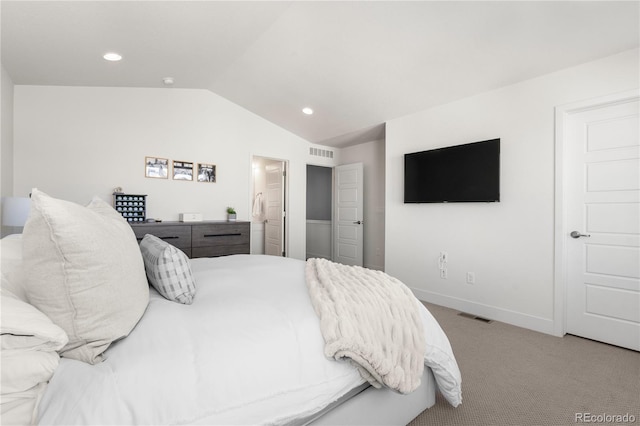 bedroom with vaulted ceiling, baseboards, visible vents, and light colored carpet