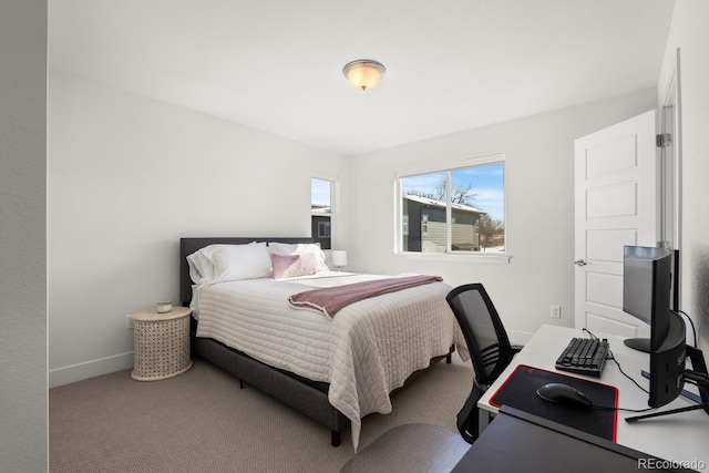 bedroom with carpet and baseboards