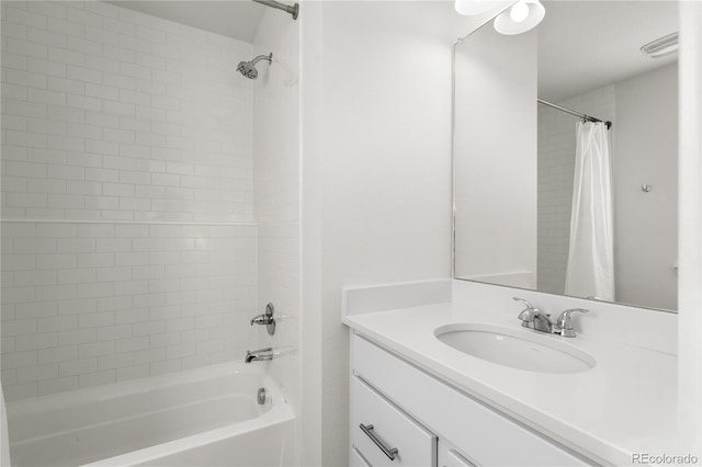 full bathroom with shower / bath combo, visible vents, and vanity