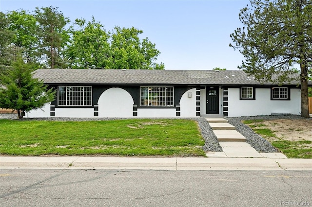 10320 W 35th Ave, Wheat Ridge, CO 80033 - single story home with stucco siding, a front lawn, and roof with shingles