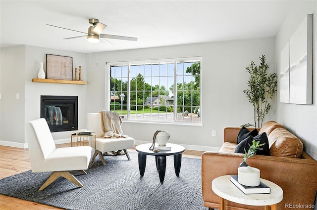 10320 W 35th Ave, Wheat Ridge, CO 80033 - living room with wood finished floors, ceiling fan, and a glass covered fireplace