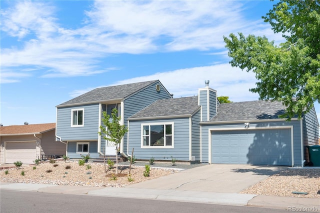 6604 S Dahlia Cir, Centennial, CO 80121 - tri-level home with an attached garage, concrete driveway, a chimney, and roof with shingles
