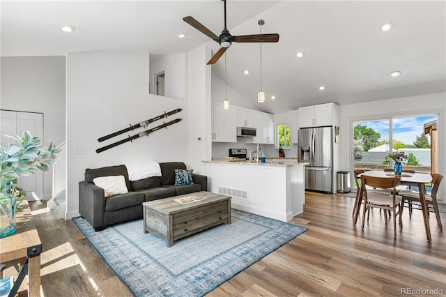 6604 S Dahlia Cir, Centennial, CO 80121 - living area with a ceiling fan, high vaulted ceiling, recessed lighting, and wood finished floors