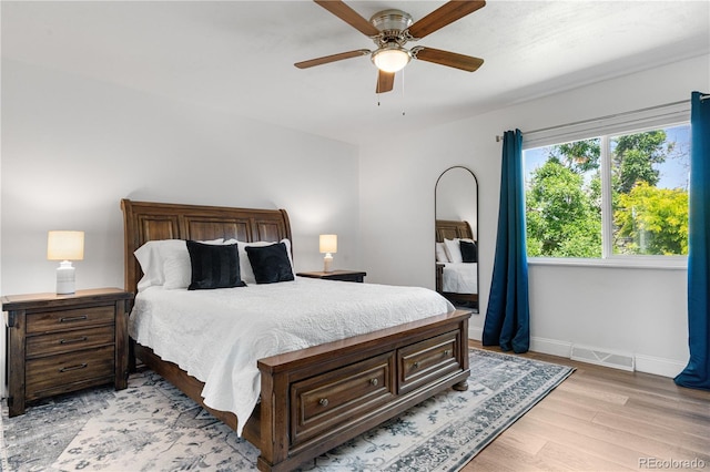 6604 S Dahlia Cir, Centennial, CO 80121 - bedroom with light wood-style flooring and a ceiling fan