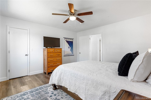 6604 S Dahlia Cir, Centennial, CO 80121 - bedroom with wood finished floors and ceiling fan